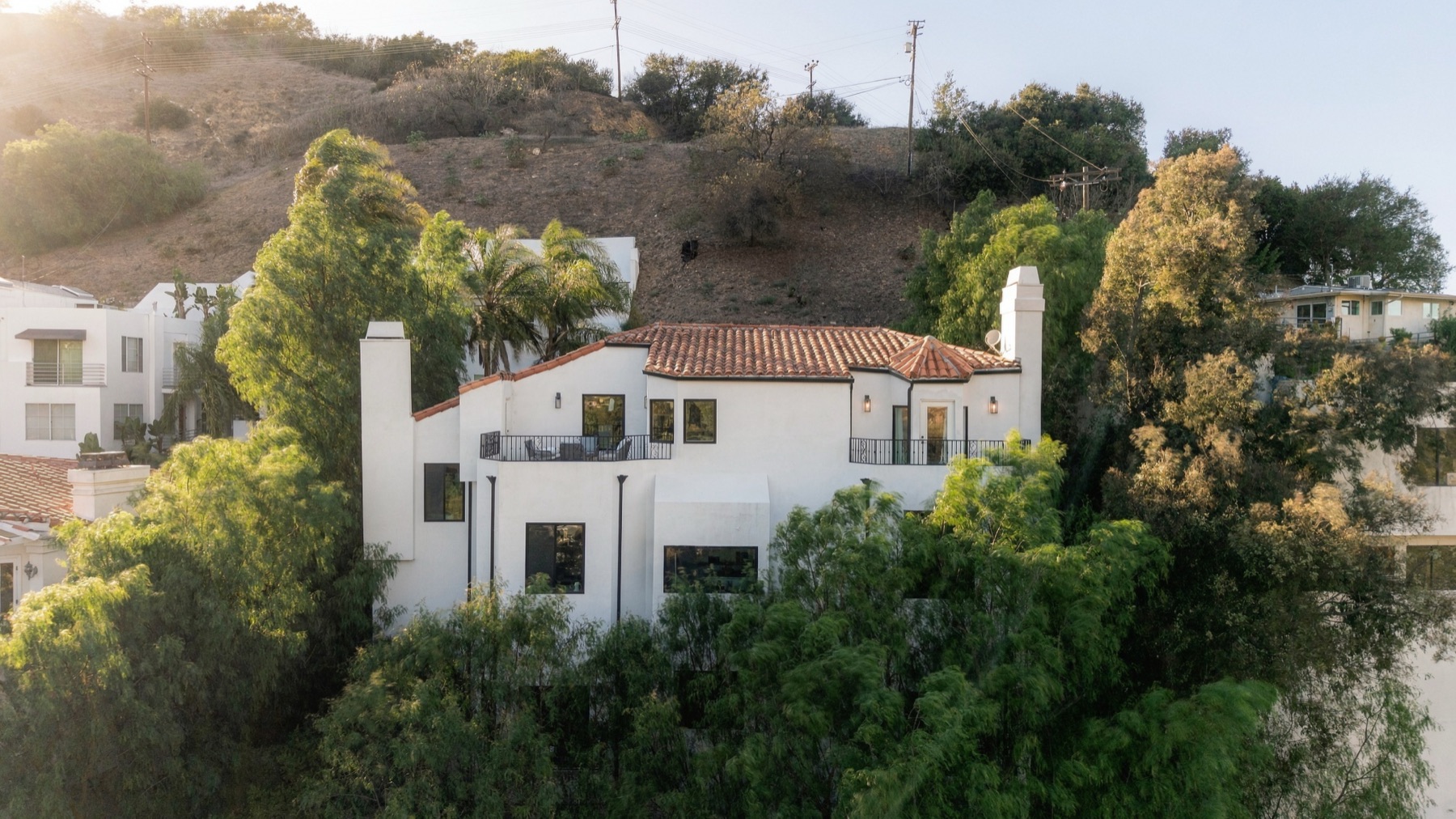 Aerial view of 3646 Potosi Avenue on the hillside with the canyon behind