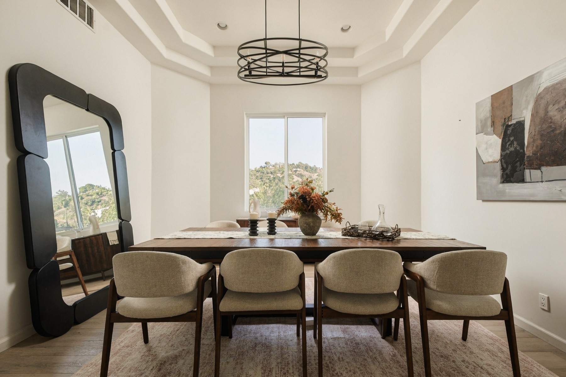 Formal dining room under a tray ceiling with the canyon in the window